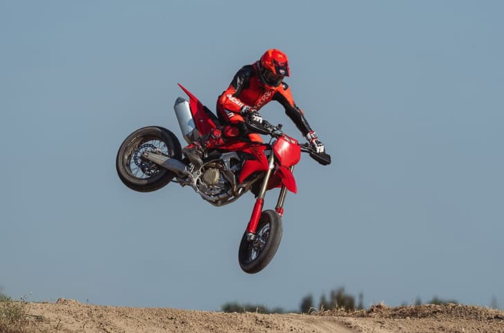 Outside image showing showing a whip being performed on the Ducati Desmo450 SM.