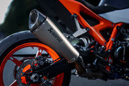 An outside close up image showing the KTM 990 Duke R's Akrapovic exhaust end can.