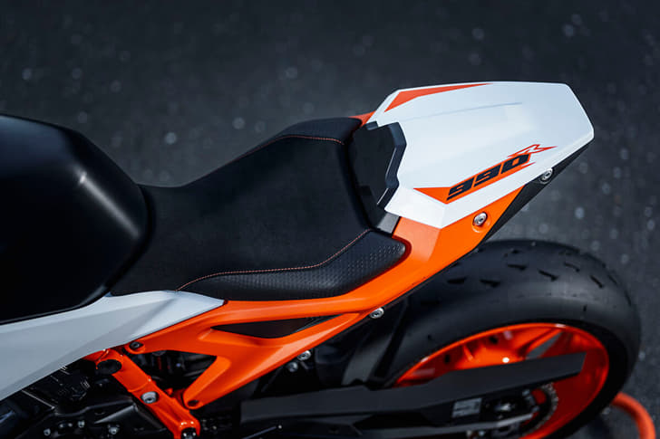 An outside close up image showing the KTM 990 Duke R's rider seat and pillion cowl.