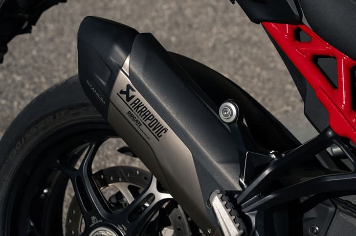 Close-up shot of the Multistrada V4 Pikes Peak's Akrapovic exhaust end can.