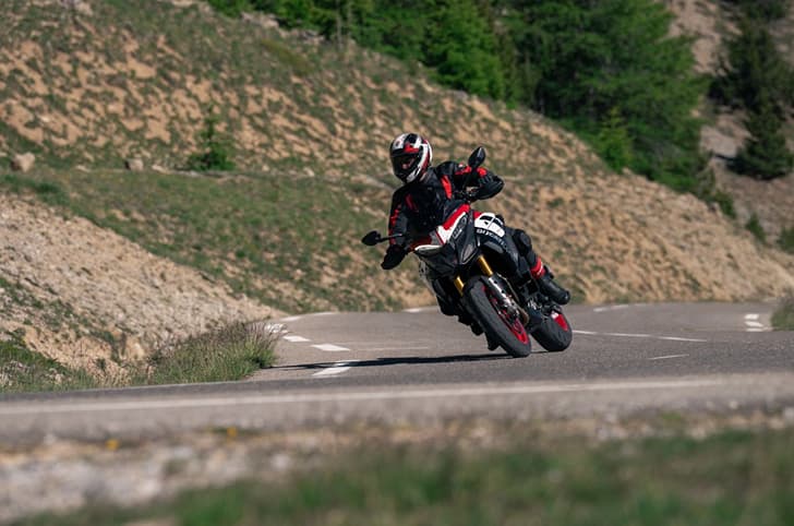 Rider performing a right leaned turn on the Multistrada V4 Pikes Peak.