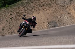 Rider performing a left leaned turn on the Multistrada V4 Pikes Peak.