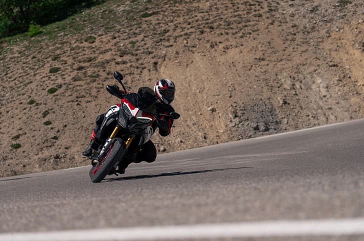 Rider performing a left leaned turn on the Multistrada V4 Pikes Peak.