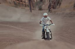 Rider preparing to jump on the Triumph Miura.