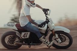 Rider performing a right-hand sweeper turn.