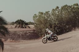 Rider landing a jump to go straight.
