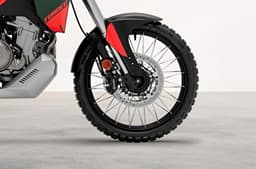 An indoor closeup render of the cross-spoked rim fitted with tubeless tyres on the standard Tuareg 