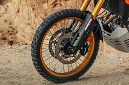 An outdoor closeup shot of the heavy-duty Ergal spoked wheels fitted with tube-type off-road tyres