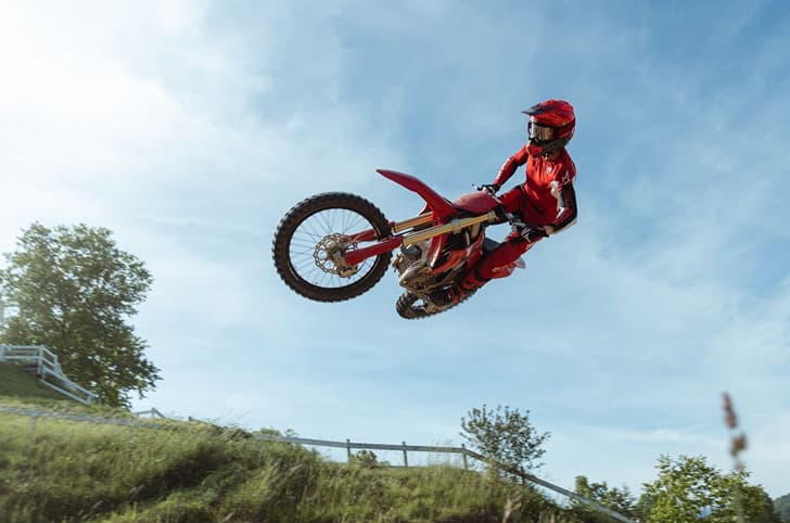 Rider performing a jump on the Desmo450 MX.
