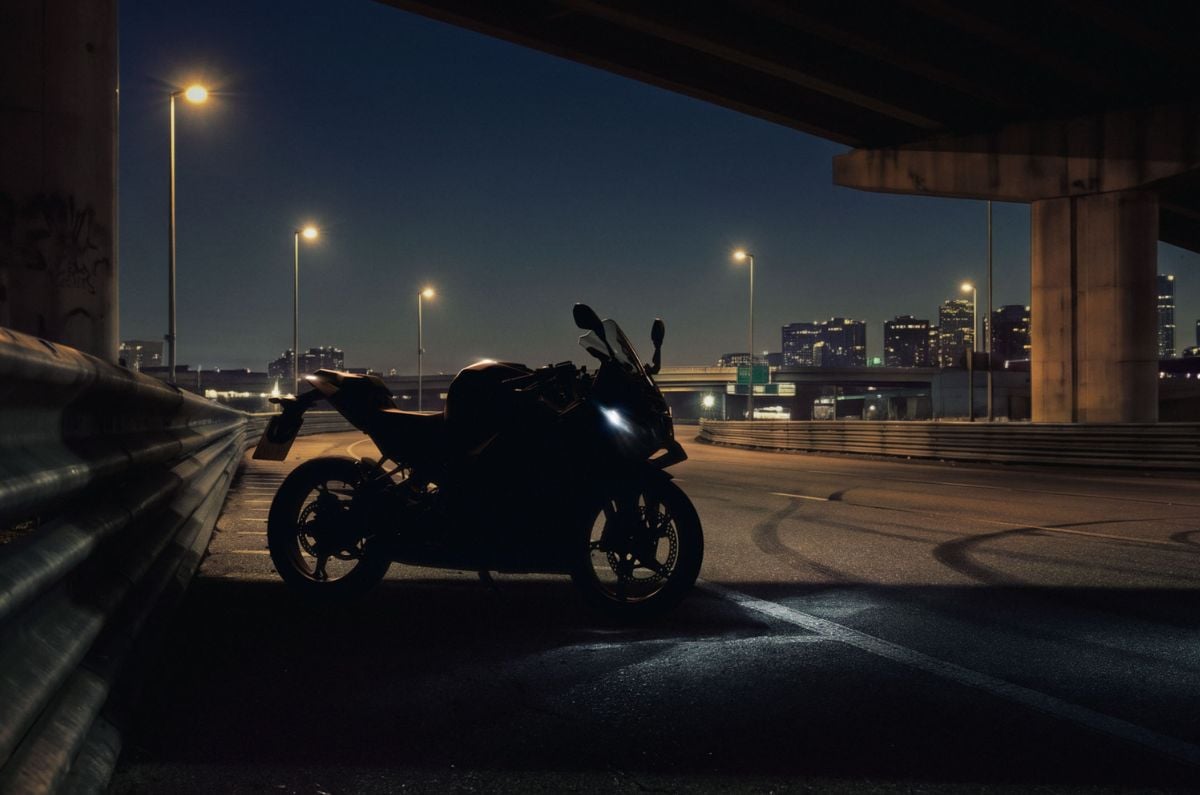 Shadow silhouette of the BMW F 450 RR on a deserted highway.