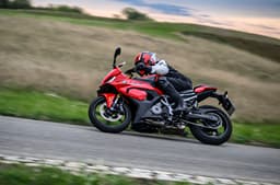 Rider performing a right leaning turn on the F 450 RR  at a racetrack, looking once again like the S 1000 RR.