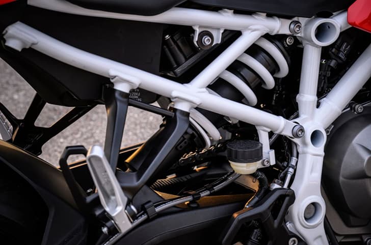 Close-up of the BMW F 450 RR's preload and rebound adjustable monoshock