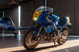 Inside shot of the Yamaha XSR900 GP Legend Blue with a small plane at the back.
