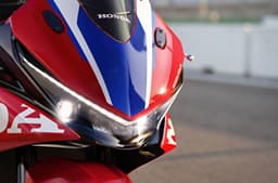 A closeup outdoor shot of the headlight of the Honda CBR500R Four