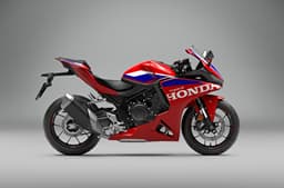 An indoor render of the Honda CBR500R Four's right side profile in HRC livery