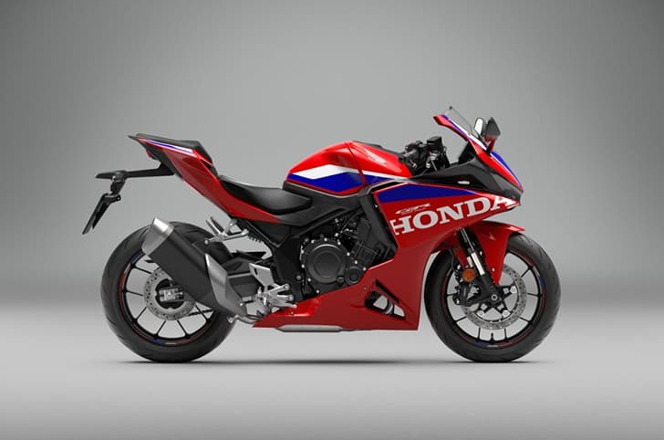 An indoor render of the Honda CBR500R Four's right side profile in HRC livery
