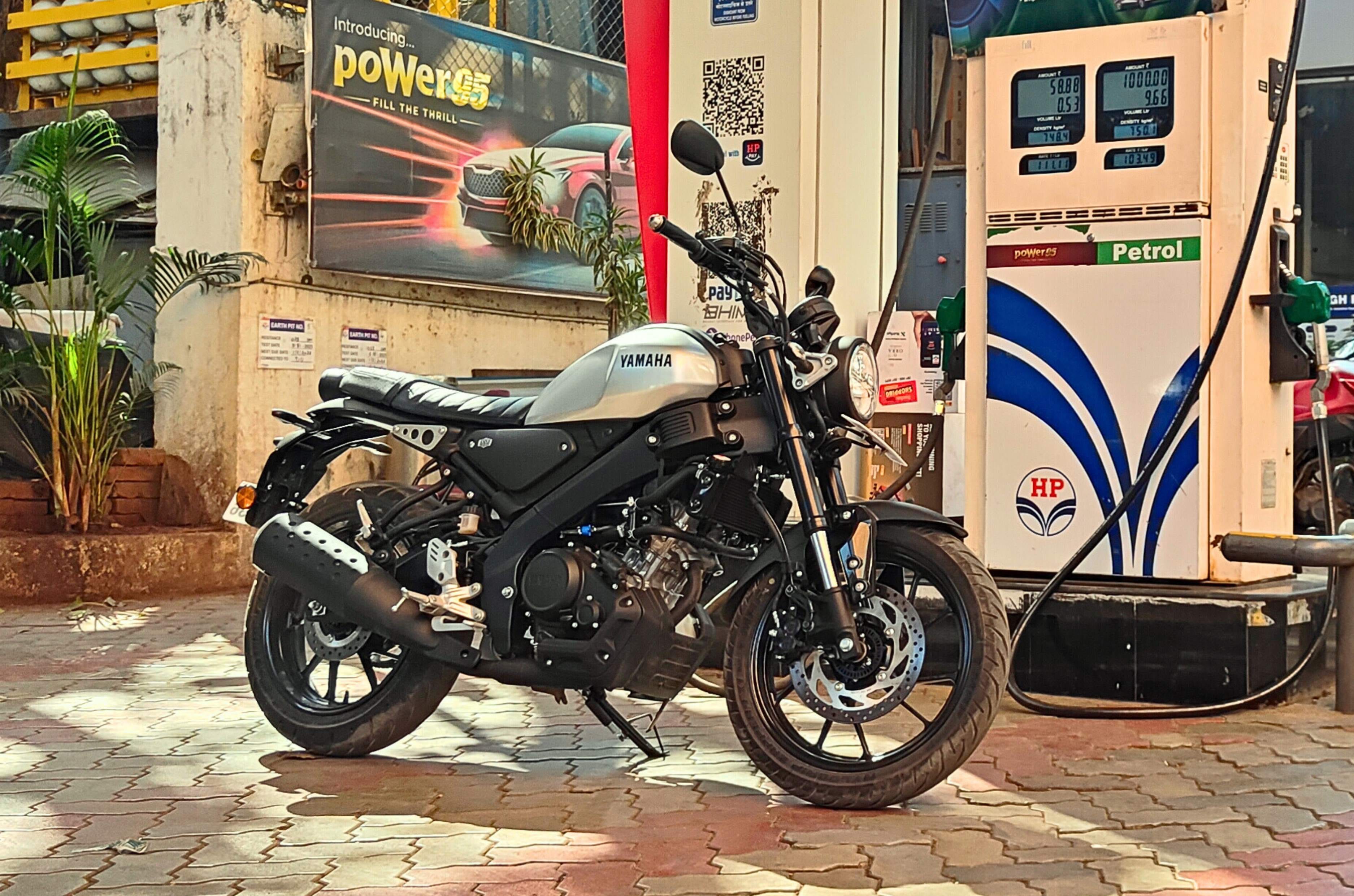 Yamaha XSR155 front right static at a petrol pump