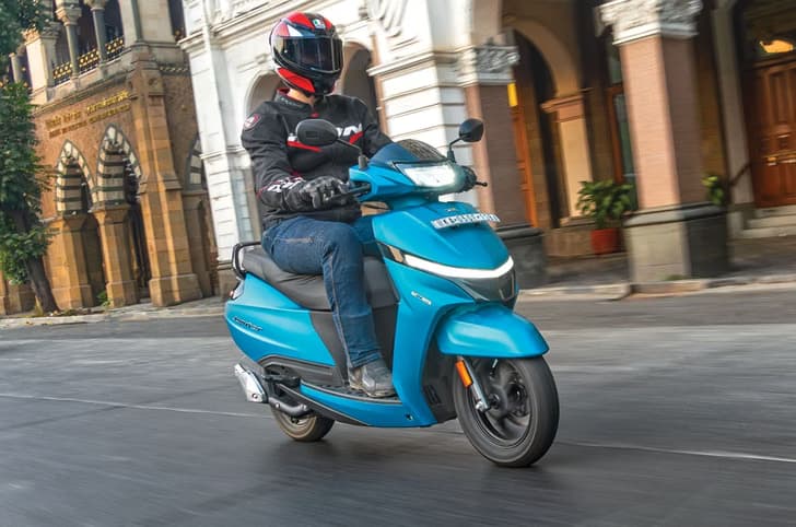 Rider cruising through urban environment on the Jupiter 110
