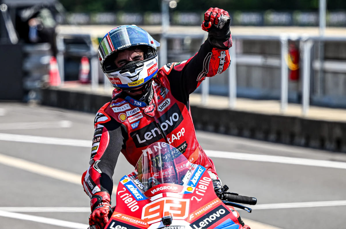 Marquez celebrating his victory with his arm in the air