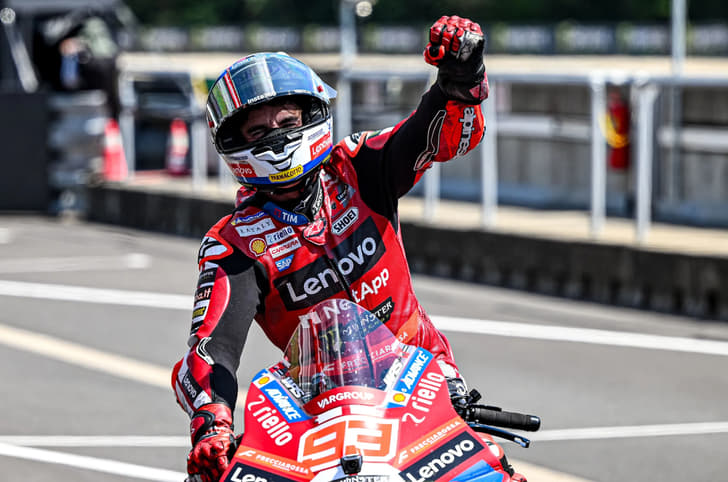 Marquez celebrating his victory with his arm in the air