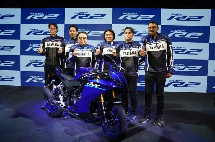 Launch event image of the R2 with top Yamaha executives