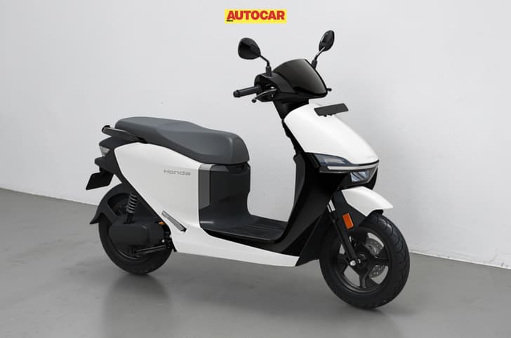 Inside render showing the Honda QC3 in Pearl Precious White colour.