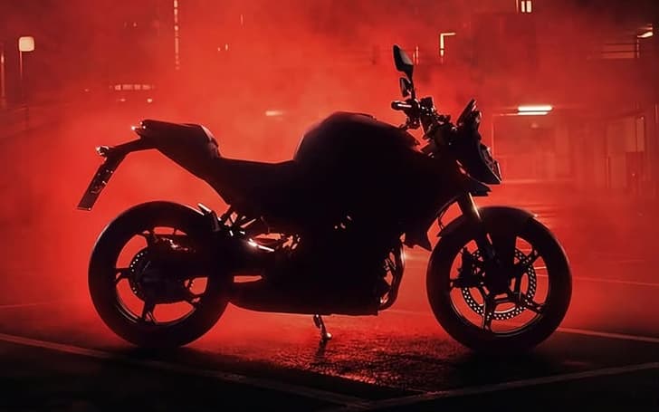 An outside, dark image teasing BMW's new roadster, expected to be called the F450R