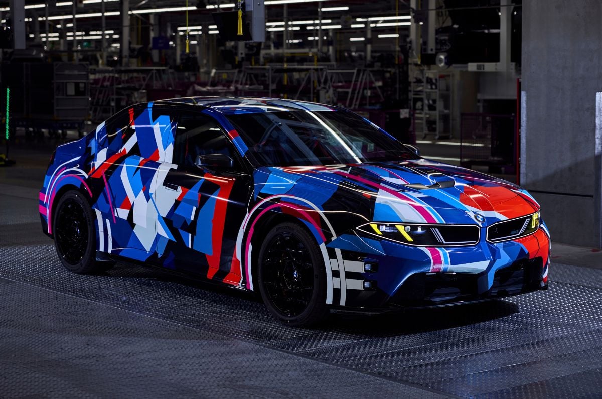 BMW M3 electric front quarter in camouflage