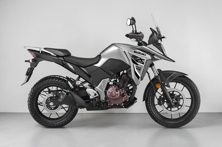 An indoor studio render showing the new Matte Grey colour option of the Suzuki V-Strom SX