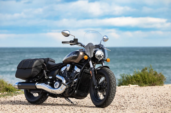 2026 Indian Super Scout parked on the coastline with the sea in the background
