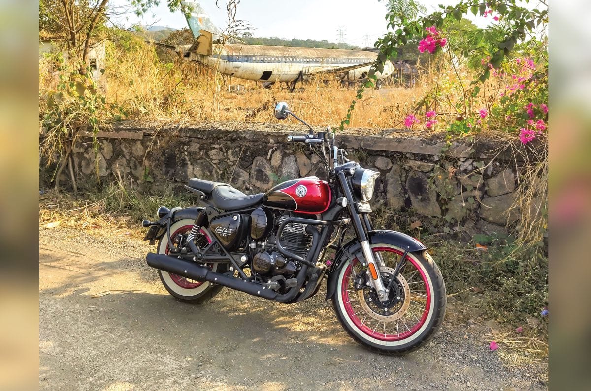 Royal Enfield Goan Classic 350 front right side image on the side of the highway with an aeroplane in the field at the background