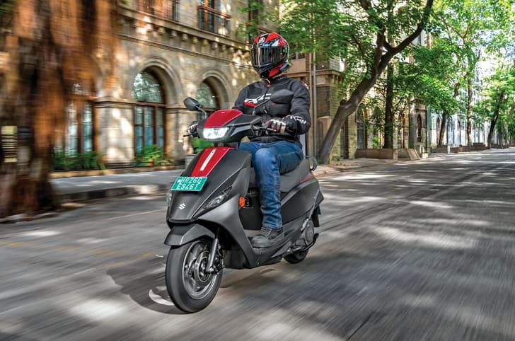 Suzuki e-Access front left side riding shot on road