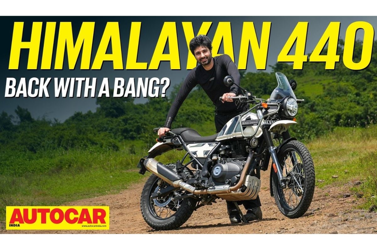 An outside image of the Royal Enfield Himalayan 440 in Nelong White colour with host Rishaad Mody.