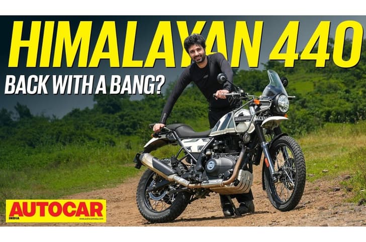 An outside image of the Royal Enfield Himalayan 440 in Nelong White colour with host Rishaad Mody.
